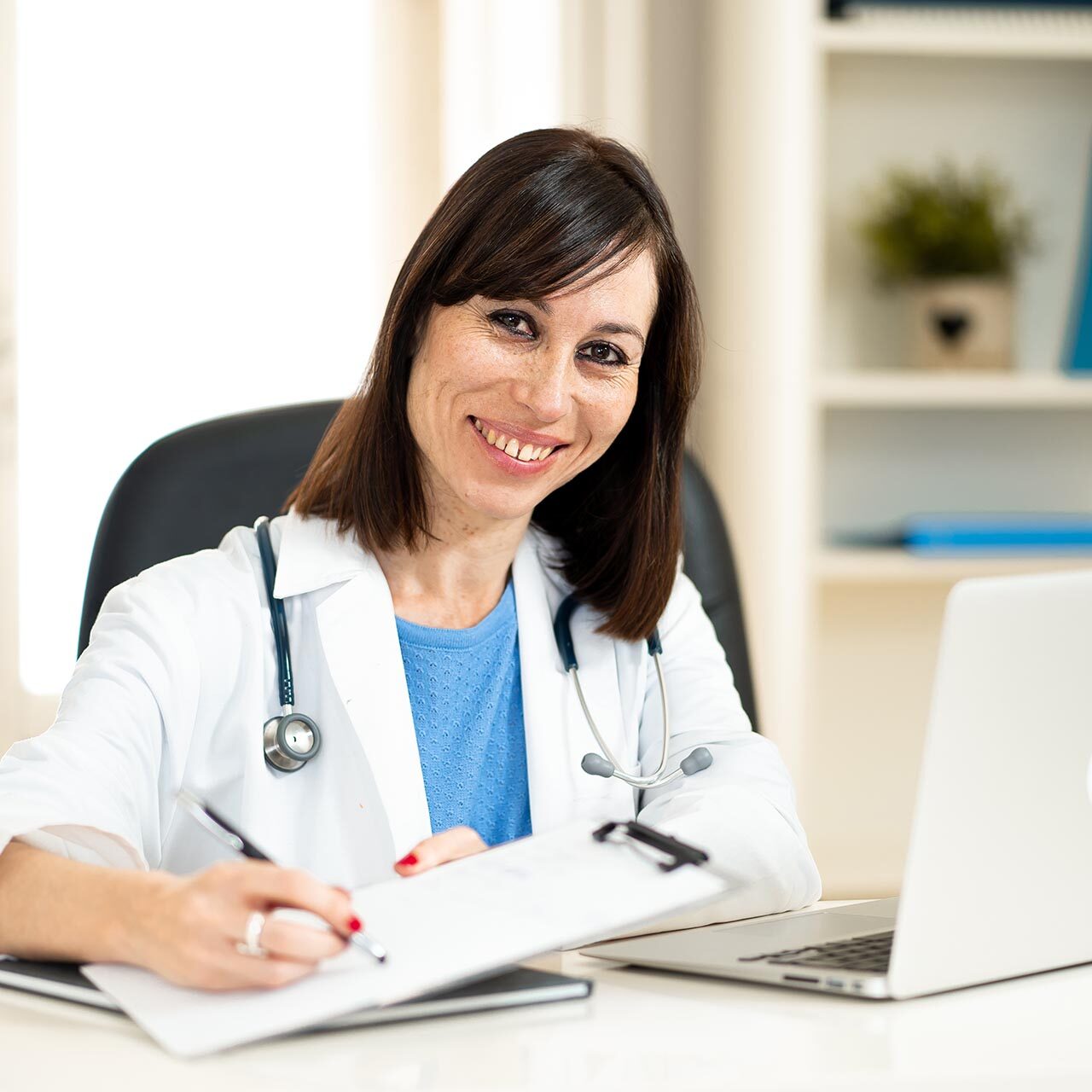 Female doctor working feeling up prescription and medical record hipaa compliance consultants