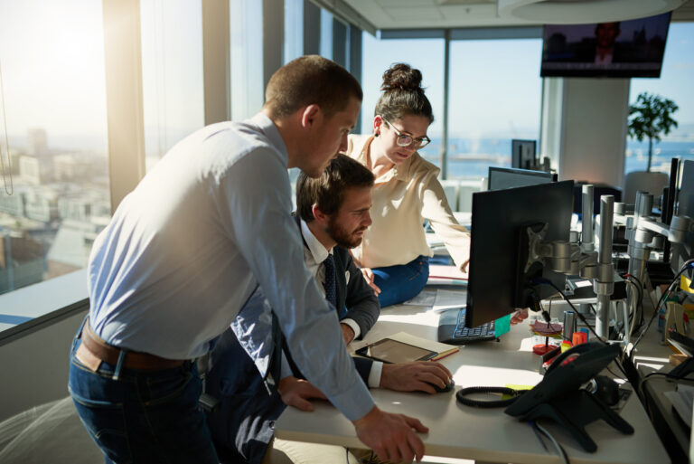 Group of business owners using cloud computing services to manage important business database.