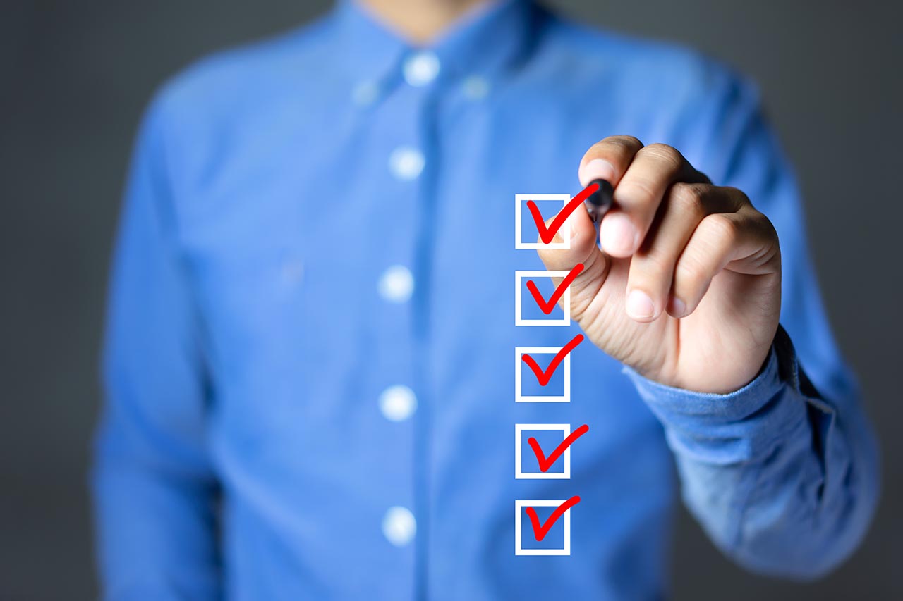Checklist concept, Businessman checking mark on the check boxes disaster recovery checklist for an smb