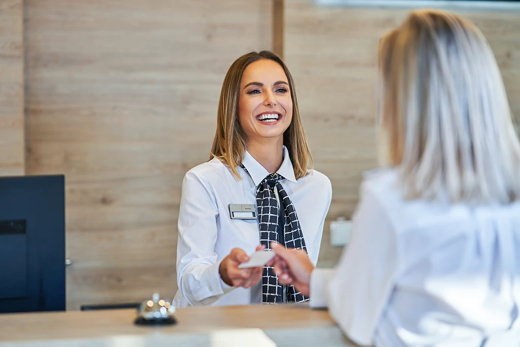 employee at front desk of an apartment complex employee at front desk of an apartment complex